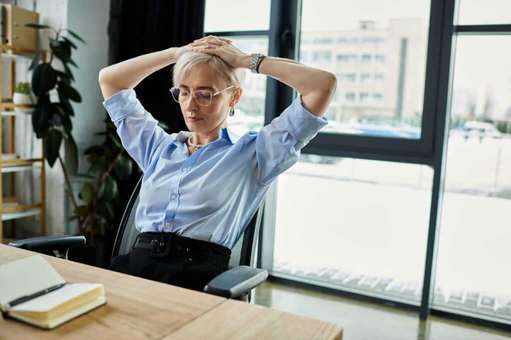 Overwhelmed businesswoman contemplating midlife challenges